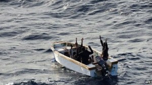 The six Somali pirates in a small motor boat surrender  The Somali pirates surrendered after being pursued by a naval helicopter